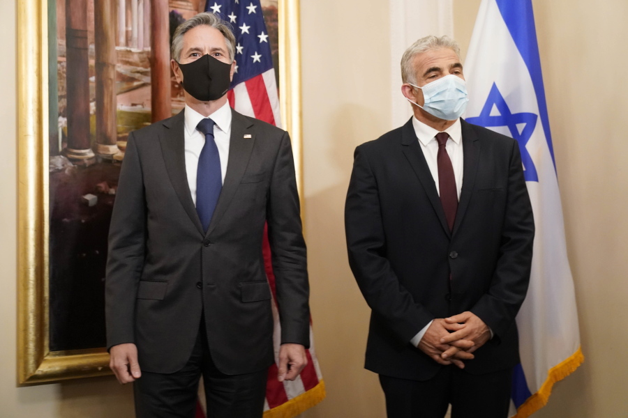 Secretary of State Antony Blinken, left, and Israeli Foreign Minister Yair Lapid pose for a family picture during their meeting in Rome, Sunday, June 27, 2021. Blinken is on a week long trip in Europe traveling to Germany, France and Italy.