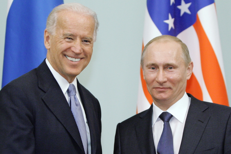 FILE - In this March 10, 2011 file photo, then Vice President  Joe Biden, left, shakes hands with Russian Prime Minister Vladimir Putin in Moscow, Russia.  At a low point in U.S.-Russian relations, President Joe Biden and Russian President Vladimir Putin appear to agree broadly on at least one thing -- their first face-to-face meeting is a chance to set the stage for a new era in arms control.