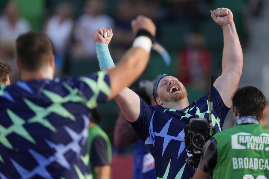 Ryan Crouser celebrates after setting a world record during the finals of men's shot put at the U.S. Olympic Track and Field Trials Friday, June 18, 2021, in Eugene, Ore.