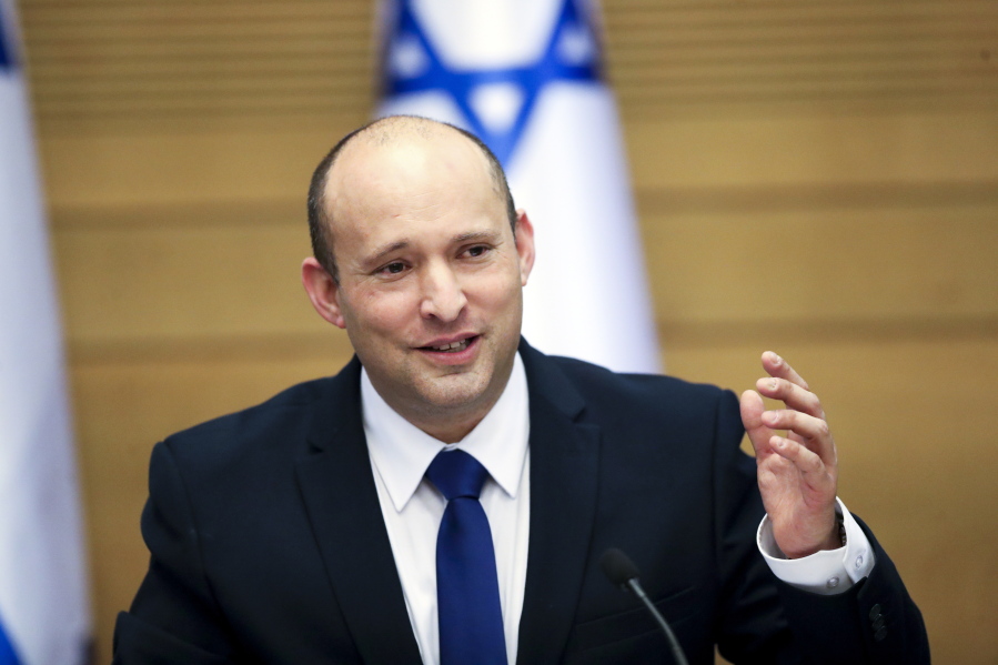 FILE - In this June 13, 2021, file photo Israel's new prime minister Naftali Bennett holds a first cabinet meeting in Jerusalem. How President Joe Biden and Prime Minister Naftali Bennett manage that relationship will shape the prospects for peace and stability in the Middle East. They are ushering in an era no longer shaped by the powerful personality of Prime Minister Benjamin Netayahu, who repeatedly defied the Obama administration, and then reaped the rewards of a warm relationship with President Donald Trump.