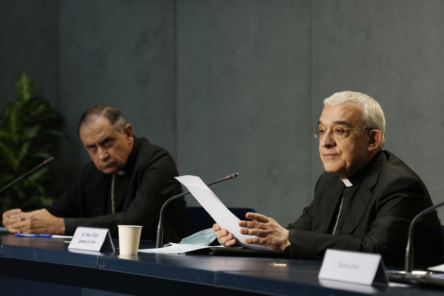 Mons. Filippo Iannone, right, and Mons. Juan Ignacio Arrieta Ochoa de Chinchetru hold a press conference to illustrate changes in the Church's Canon law, at the Vatican, Tuesday, June 1, 2021. Pope Francis has changed church law to explicitly criminalize the sexual abuse of adults by priests who abuse their authority and to say that laypeople who hold church office can be sanctioned for similar sex crimes.