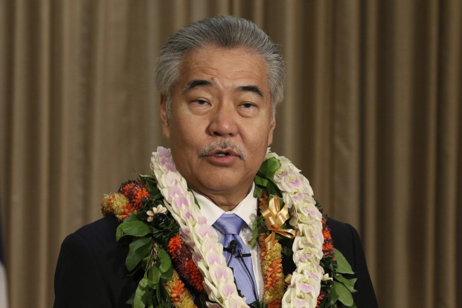 FILE - In this Jan. 21, 2020, file photo, Gov. David Ige speaks to reporters in Honolulu after delivering his state of the state address at the Hawaii State Capitol. While governors across the country are ending all or most of their coronavirus restrictions, many of them are keeping their pandemic emergency orders in place. Those orders allow them to restrict public gatherings and businesses, mandate masks, sidestep normal purchasing rules, tap into federal money and deploy National Guard troops to administer vaccines.