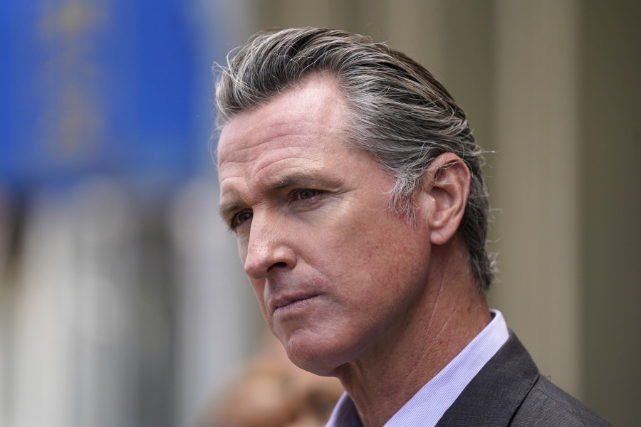 FILE - In this June 3, 2021 file photo, California Gov. Gavin Newsom listens to questions during a news conference outside a restaurant in San Francisco While governors across the country are ending all or most of their coronavirus restrictions, many of them are keeping their pandemic emergency orders in place. Those orders allow them to restrict public gatherings and businesses, mandate masks, sidestep normal purchasing rules, tap into federal money and deploy National Guard troops to administer vaccines.