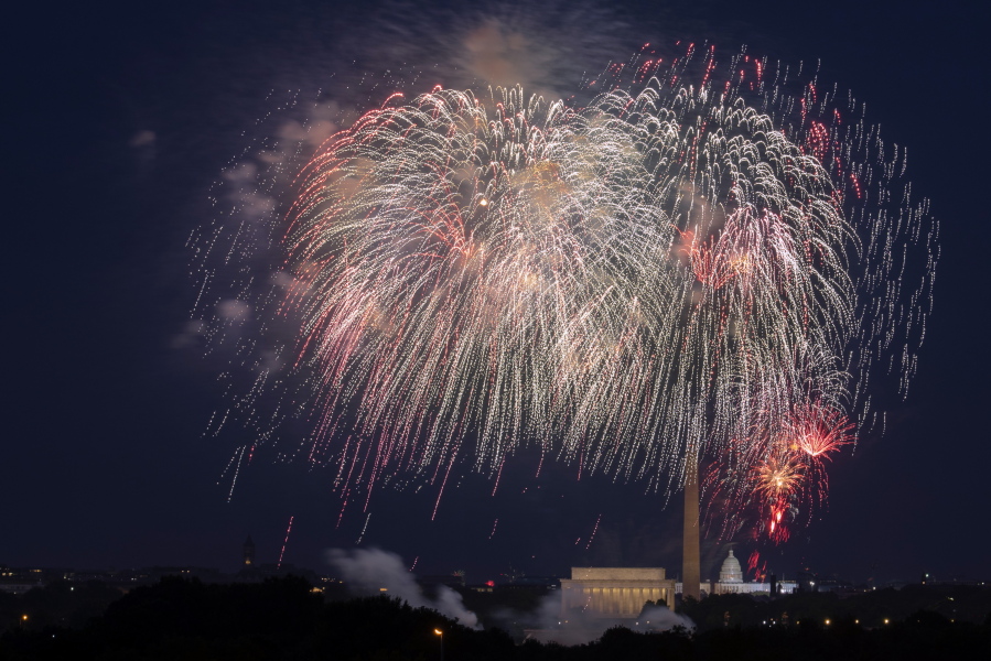 FILE - In this Saturday, July 4, 2020, file photo, Fourth of July fireworks explode over the Lincoln Memorial, the Washington Monument and the U.S. Capitol along the National Mall in Washington. President Joe Biden wants to imbue Independence Day with new meaning in 2021 by encouraging nationwide celebrations to mark the country's effective return to normalcy after 16 months of pandemic disruption. The White House says the National Mall in Washington will host the traditional fireworks ceremony and it's encouraging other communities hold festivities as well.