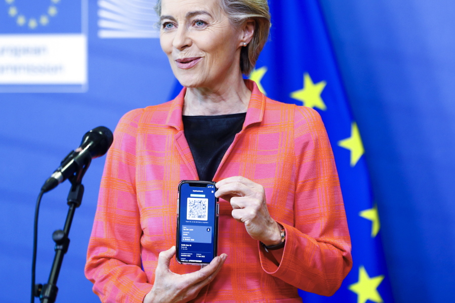European Commission President Ursula von der Leyen shows her EU Digital Covid Certificate as she gives a press statement on the new COVID-19 digital travel certificate at the European Commission headquarters in Brussels, Wednesday, June 16, 2021.