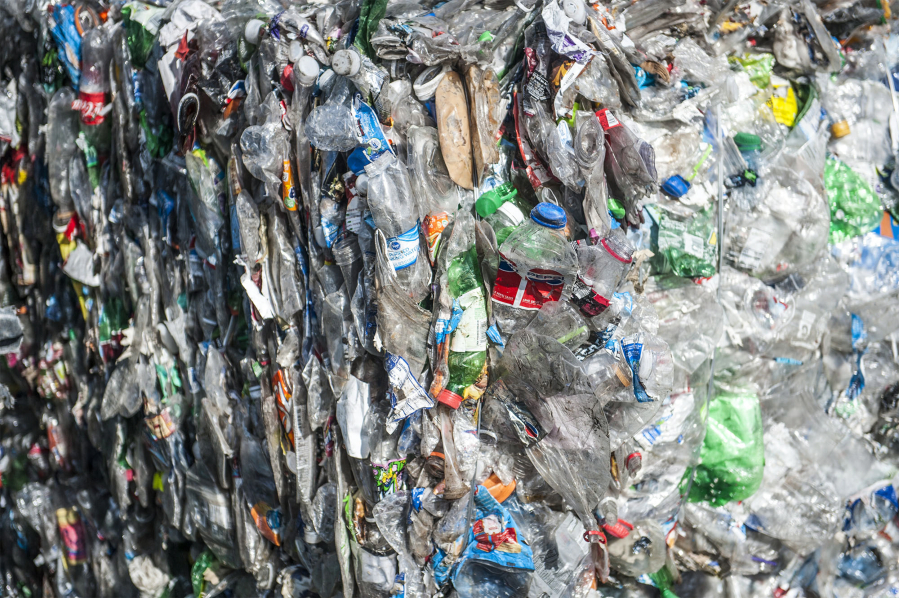 Plastic bottles are baled together for recycling, but reducing plastic use is even better, environmental advocates say.