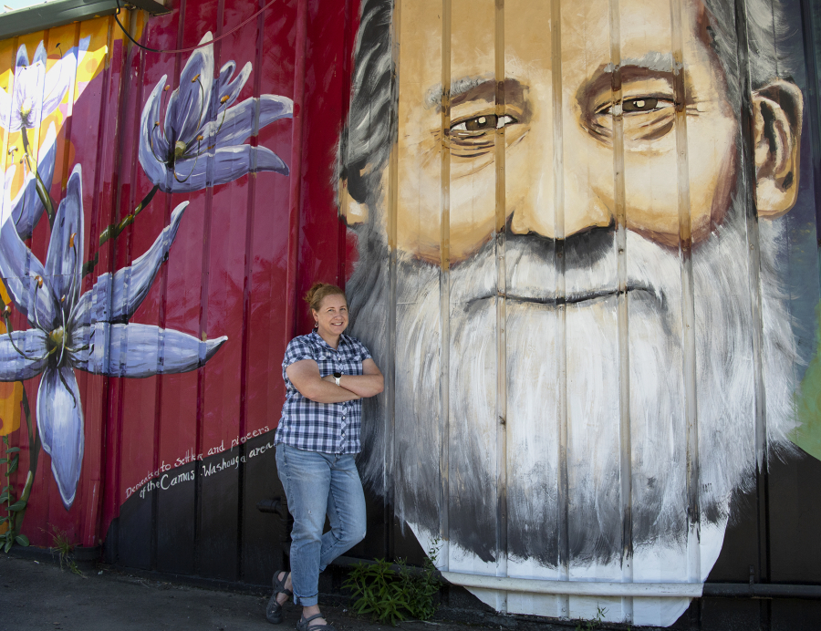 Descendant Anne Christie poses next to the face of Richard Ough, the founder of Washougal and her triple-great grandfather. "We love it," Christie said. "This is my dad's family.