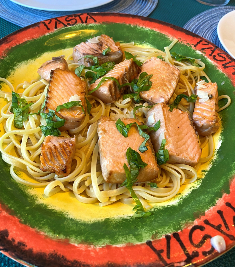 This is summer chinook in a white wine, garlic, fresh basil, olive oil sauce over fettuccine.