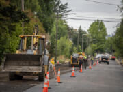Street paving in preparation for the new bike lane striping project is underway along Columbia Street near the intersection of 33rd Street on Wednesday morning. The contractor, Granite Construction, expects to wrap up the first phase of the work in mid-July.