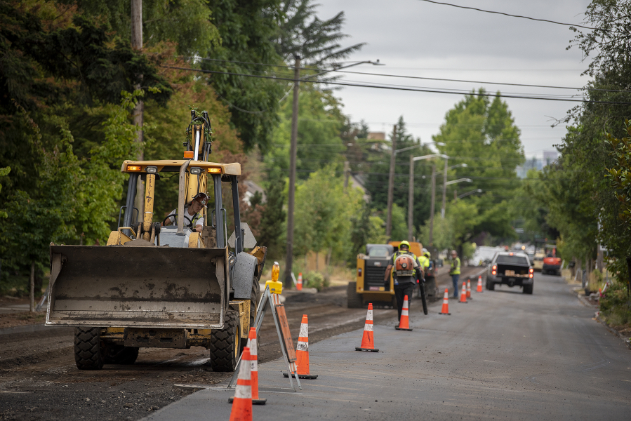 Street paving in preparation for the new bike lane striping project is underway along Columbia Street near the intersection of 33rd Street on Wednesday morning. The contractor, Granite Construction, expects to wrap up the first phase of the work in mid-July.