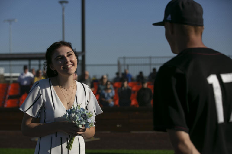 Eli Shubert, pitcher for the Ridgefield Raptors, marries Erin Thum in a short ceremony on the field before a game against the Port Angeles Lefties at Ridgefield Outdoor Recreation Complex on Wednesday, July 14, 2021.