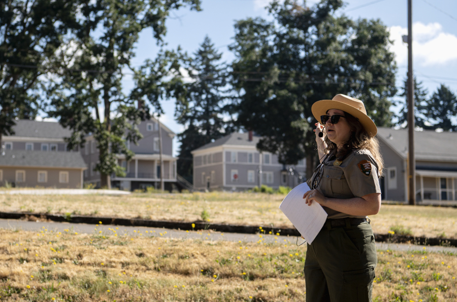 Joshua Hart/The Columbian 
 National Park Service curator Meagan Huff points toward the East Barracks on a July 17 walking tour discussing its history in the 1880s.