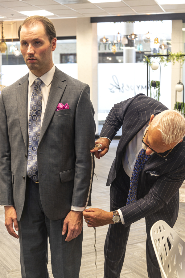 VAN MALL: Glen Johnson gets measured for new clothing with menswear designer David Ambrico at the Big Reveal event at Vancouver Mall.