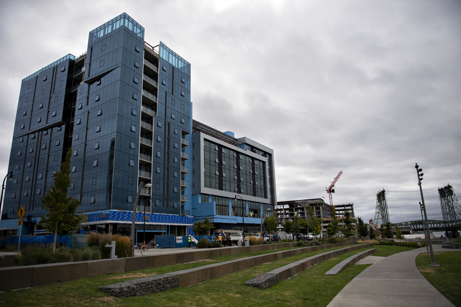 Kirkland Tower, left, the nearly completed condo tower at The Waterfront Vancouver, is pictured with Hotel Indigo at The Waterfront Vancouver. The two projects from Vancouver-based Kirkland Development are being built together but will function as separate buildings.
