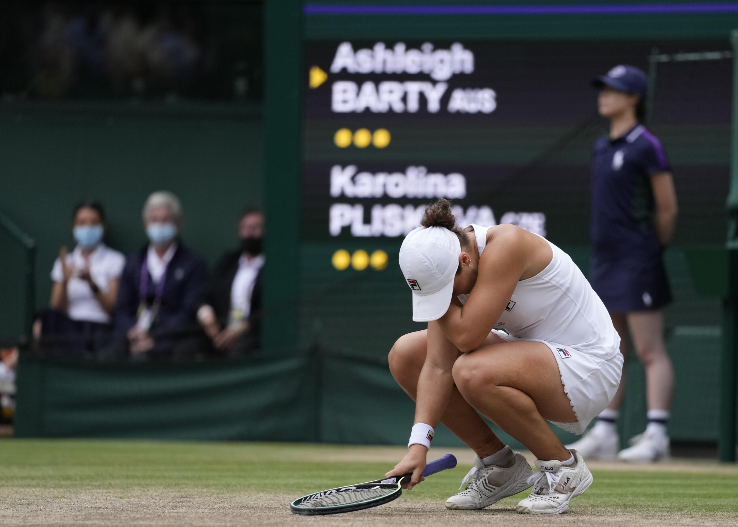 Australia's Ashleigh Barty reacts after defeating the Czech Republic's Karolina Pliskova in the women's singles final on day twelve of the Wimbledon Tennis Championships in London, Saturday, July 10, 2021.