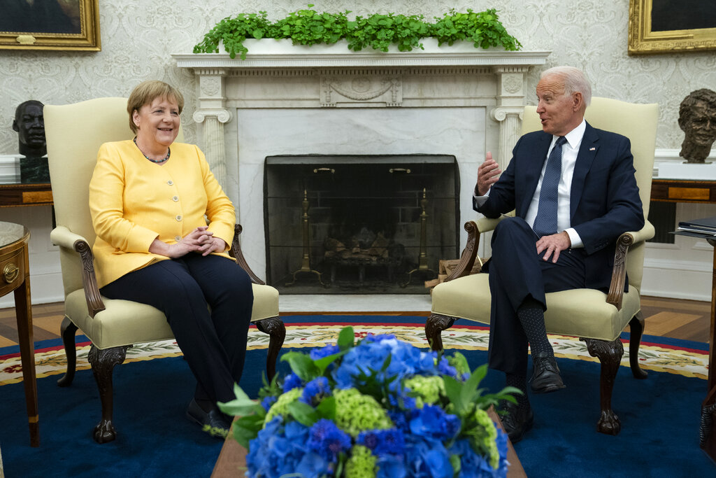 President Joe Biden meets with German Chancellor Angela Merkel in the Oval Office of the White House, Thursday, July 15, 2021, in Washington.