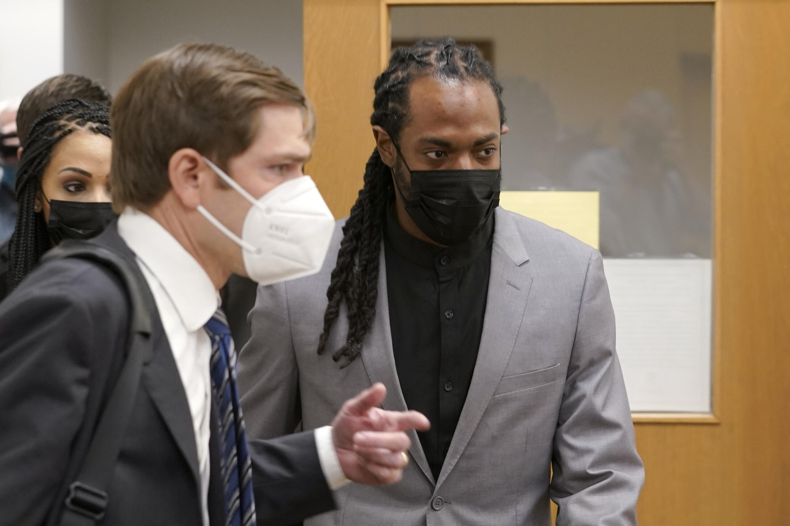 NFL football player Richard Sherman, right, heads into a hearing at King County District Court with his attorney Cooper Offenbecher, Friday, July 16, 2021, in Seattle. Prosecutors in Washington state have charged Sherman, who has played for the Seattle Seahawks and the San Francisco 49ers NFL football teams, after police said he drunkenly crashed his SUV in a construction zone and tried to break into his in-laws' home. (AP Photo/Ted S.