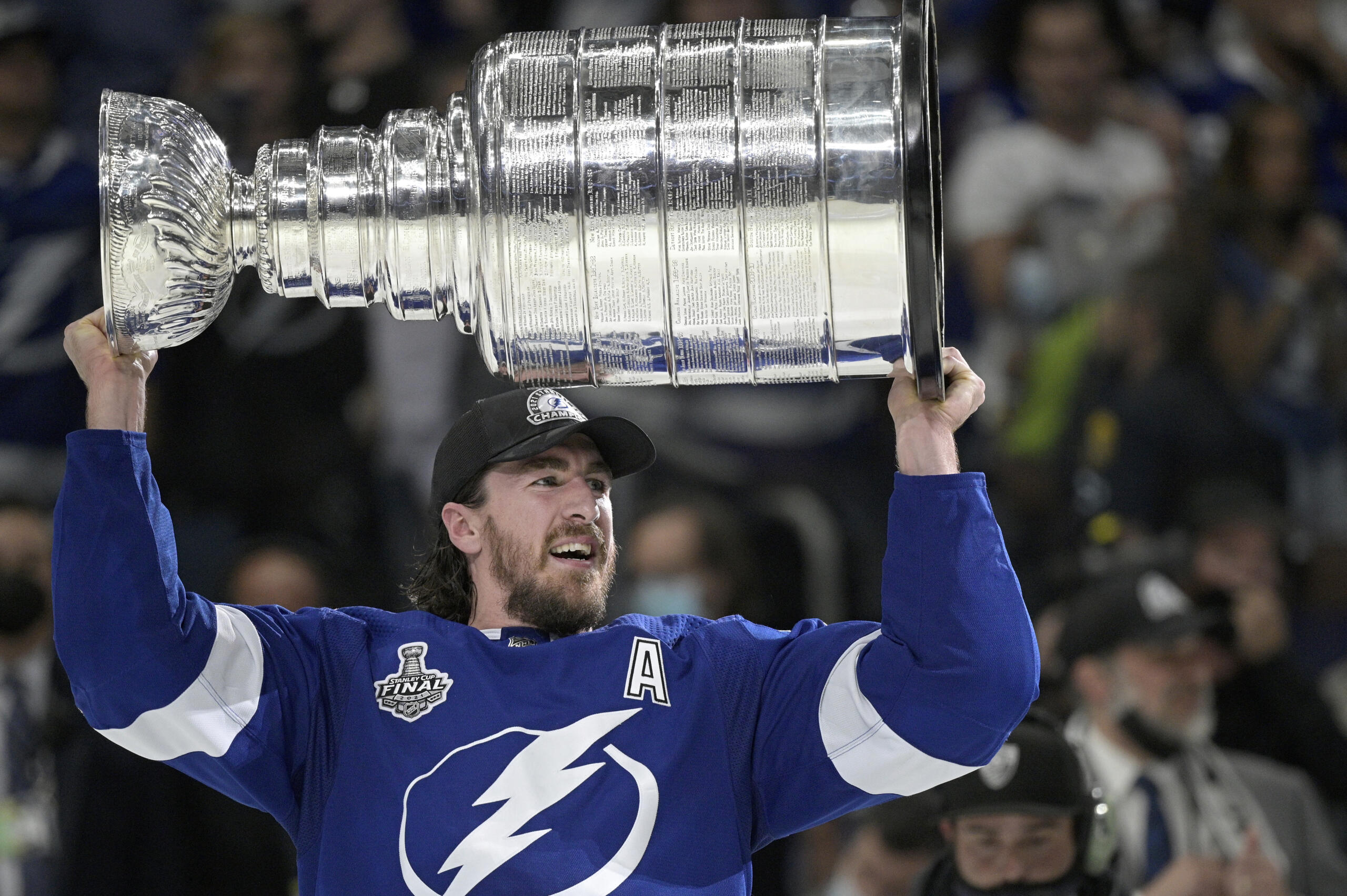 Tampa Bay Lightning defenseman Ryan McDonagh hoists the Stanley Cup after getting the win over the Montreal Canadiens in Game 5 of the NHL hockey Stanley Cup finals series, Wednesday, July 7, 2021, in Tampa, Fla. (AP Photo/Phelan M.