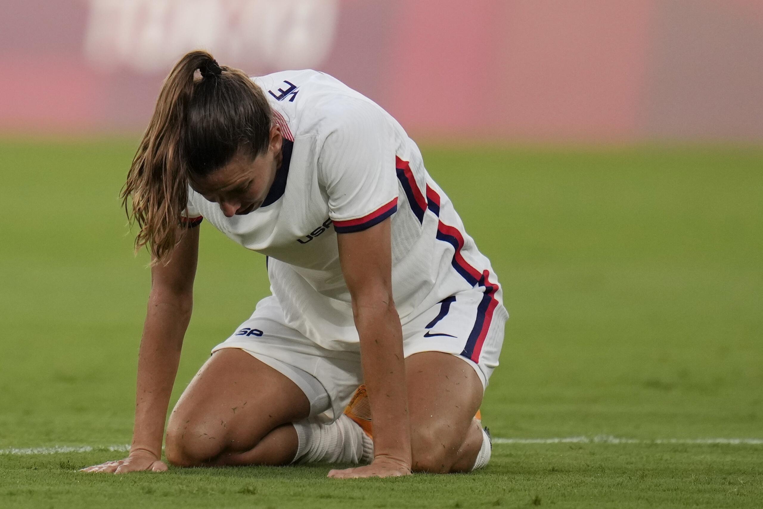 United States' Tobin Heath reacts after losing 3-0 against Sweden during a women's soccer match at the 2020 Summer Olympics, Wednesday, July 21, 2021, in Tokyo.