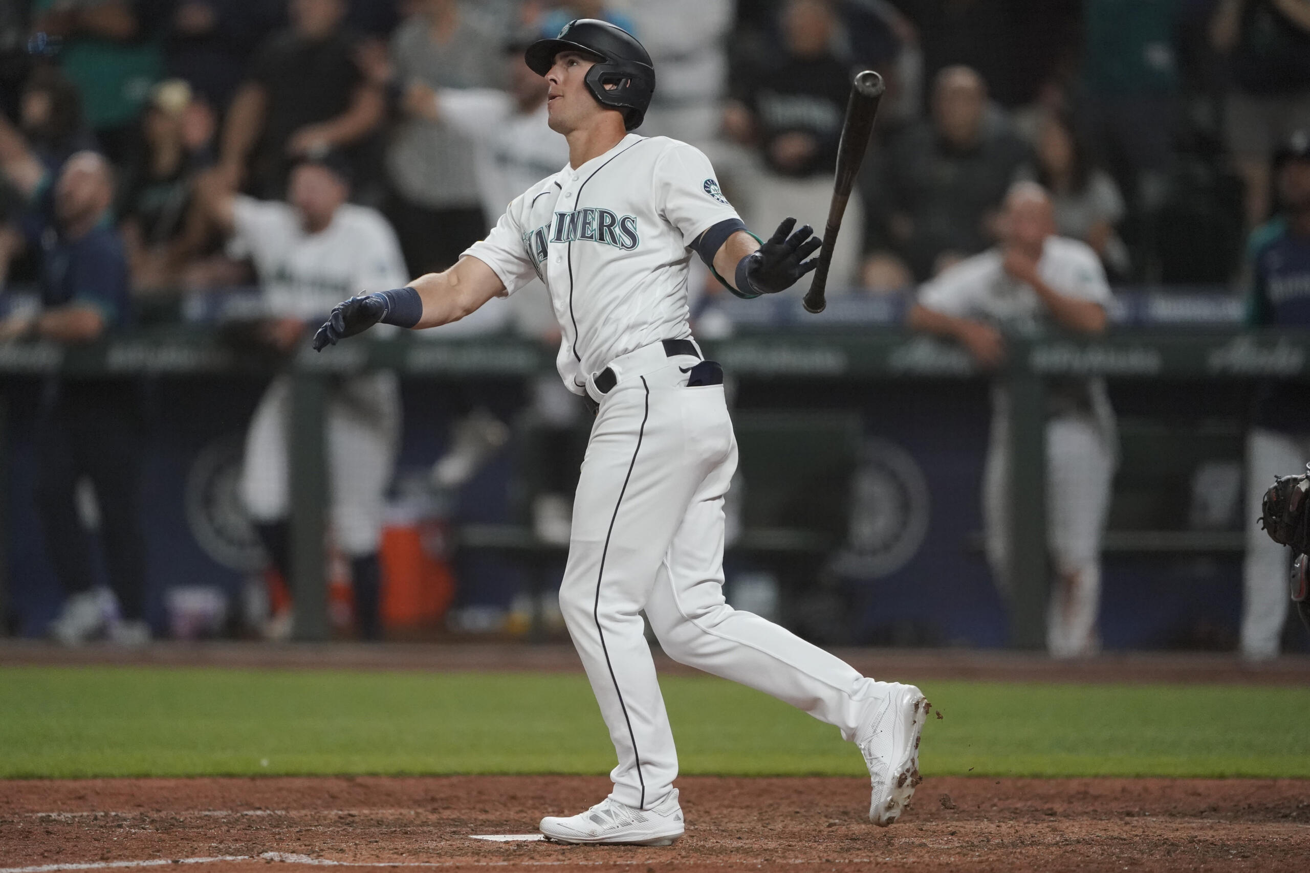 Seattle Mariners' Dylan Moore watches his grand slam during the eighth inning of a baseball game against the Houston Astros, Monday, July 26, 2021, in Seattle. (AP Photo/Ted S.