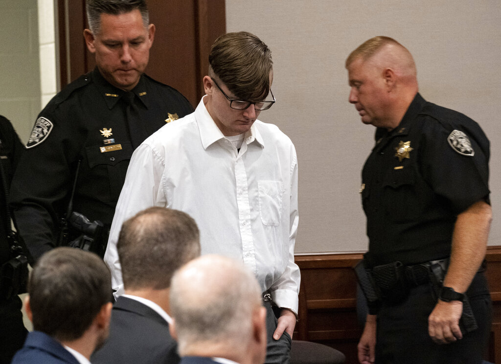 Robert Aaron Long enters Superior Court of Cherokee County in Canton, Ga. on Tuesday, July 27, 2021. Long, accused of killing eight people, most of them women of Asian descent at an Atlanta-area massage businesses pleaded guilty to four of the murders and was handed four sentences of life without parole.