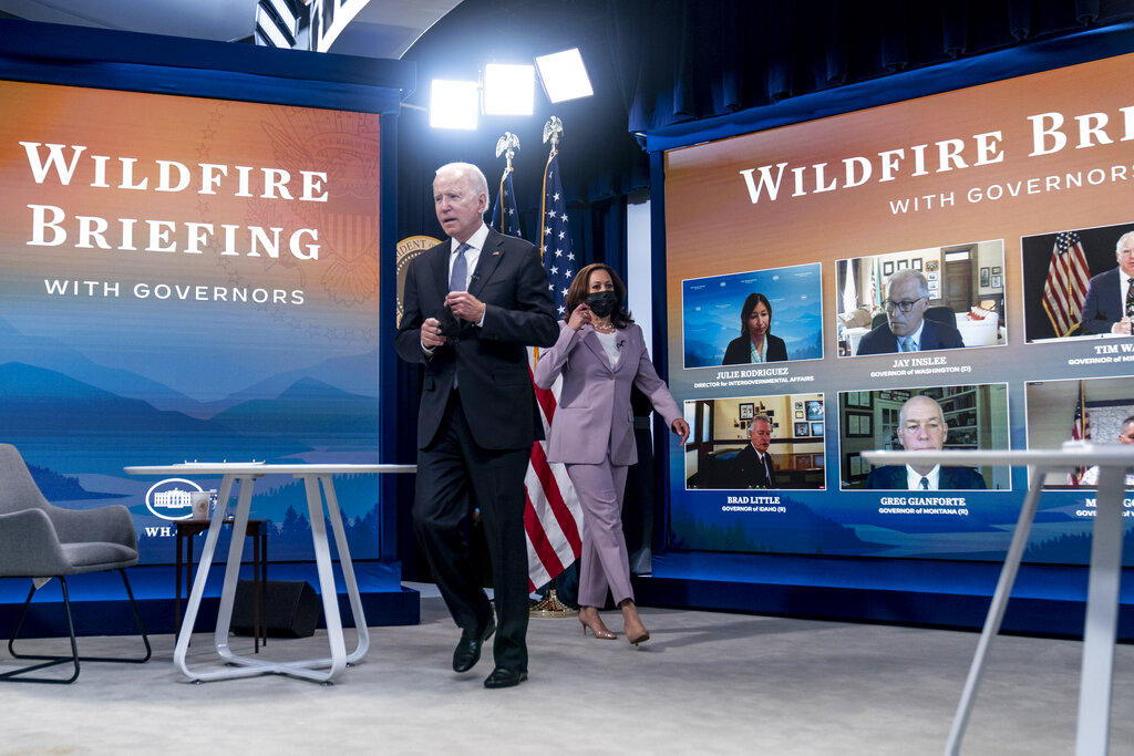 President Joe Biden and Vice President Kamala Harris arrive for a meeting with governors to discuss ongoing efforts to strengthen wildfire prevention, preparedness and response efforts, and hear firsthand about the ongoing impacts of the 2021 wildfire season in the South Court Auditorium in the Eisenhower Executive Office Building on the White House Campus in Washington, Friday, July 30, 2021.