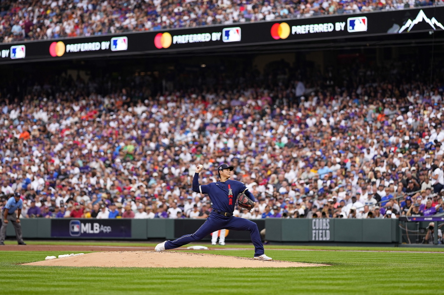 American League's starting pitcher Shohei Ohtani, of the Los Angeles Angeles, throws during the first inning of the MLB All-Star baseball game, Tuesday, July 13, 2021, in Denver.