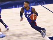United States' Damian Lillard (6) brings the ball up court against Argentina during the first half of an exhibition basketball game in Las Vegas on Tuesday, July 13, 2021.