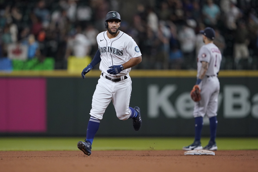 Seattle Mariners' Abraham Toro rounds the bases after hitting a two-run home run against the Houston Astros during the ninth inning of a baseball game, Tuesday, July 27, 2021, in Seattle. Toro was traded to the Mariners from the Astros earlier in the day. The Astros won 8-6. (AP Photo/Ted S.
