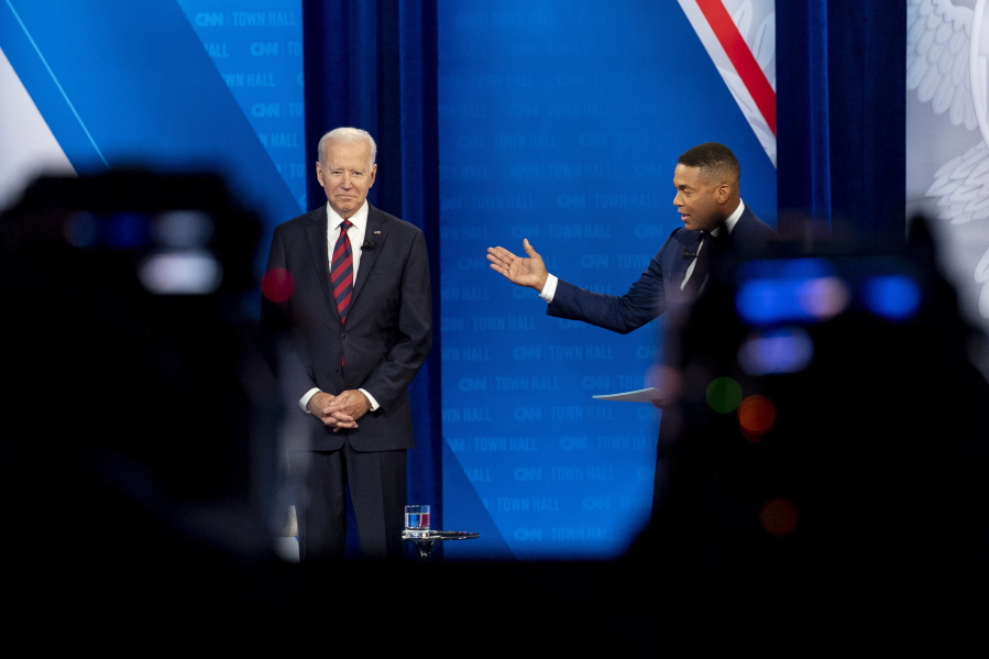 Cameras are visible in the foreground as President Joe Biden accompanied by CNN journalist Don Lemon, right, appears at a CNN town hall at Mount St. Joseph University in Cincinnati, Wednesday, July 21, 2021.