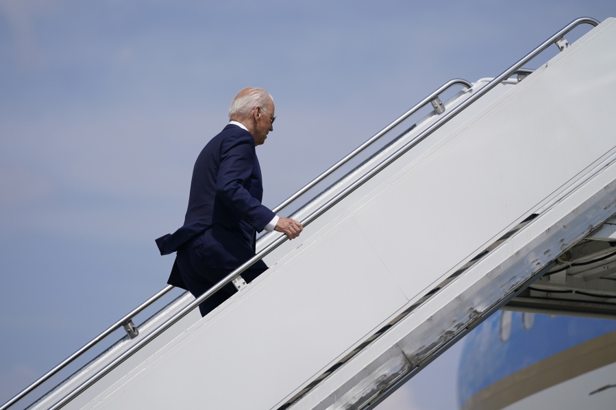 President Joe Biden boards Air Force One at O'Hare International Airport, Wednesday, July 7, 2021, in Chicago.