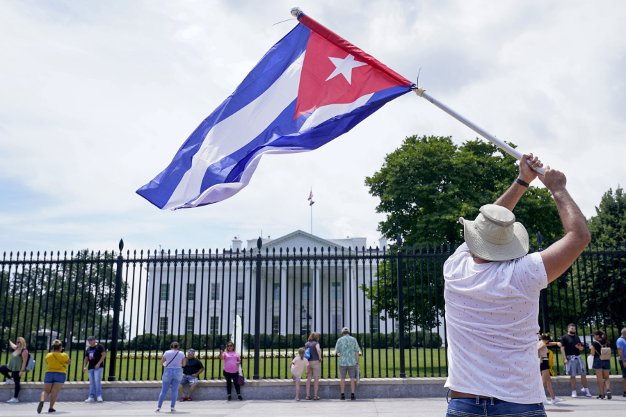 People participate in a rally outside the White House in Washington, Tuesday, July 13, 2021, in support of the protesters in Cuba. The problems of two tiny Caribbean states, Cuba and Haiti, have vexed U.S. presidents for decades.