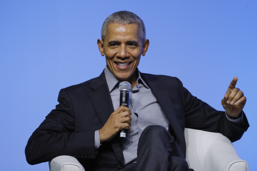 FILE - Former U.S. President Barack Obama gesture as he attends the "values-based leadership" during a plenary session of the Gathering of Rising Leaders in the Asia Pacific, organized by the Obama Foundation in Kuala Lumpur, Malaysia, on Dec. 13, 2019. Obama's memoir "Dreams from My Father" will be released in a young adult edition on October 5. Obama had yet to hold any political office when "Dreams from My Father" was released in 1995.