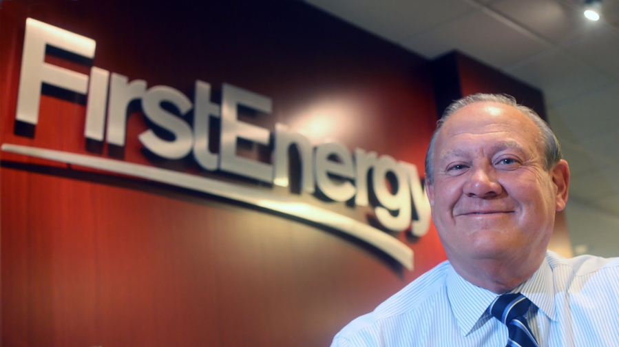 FILE - In this 2015 file photo, FirstEnergy Corp. then-President and CEO Charles "Chuck" Jones appears at the company's Akron, Ohio headquarters. Six top executives from the company have been fired, including Jones, since the alleged $60 million bribery case, involving ex-Ohio House Speaker Larry Householder and others. Federal authorities say the Akron-based FirstEnergy Corp. has agreed to a settlement that calls for the company to fully cooperate and pay a $230 million fine as part of a sweeping bribery scheme. The dismissal of Jones, who initially denied any wrongdoing by the company, appeared to be tied to a $4.3 million payment that FirstEnergy made in January 2019, purportedly to end a longstanding consulting contract with a person soon to be appointed Ohio's top utility regulator.