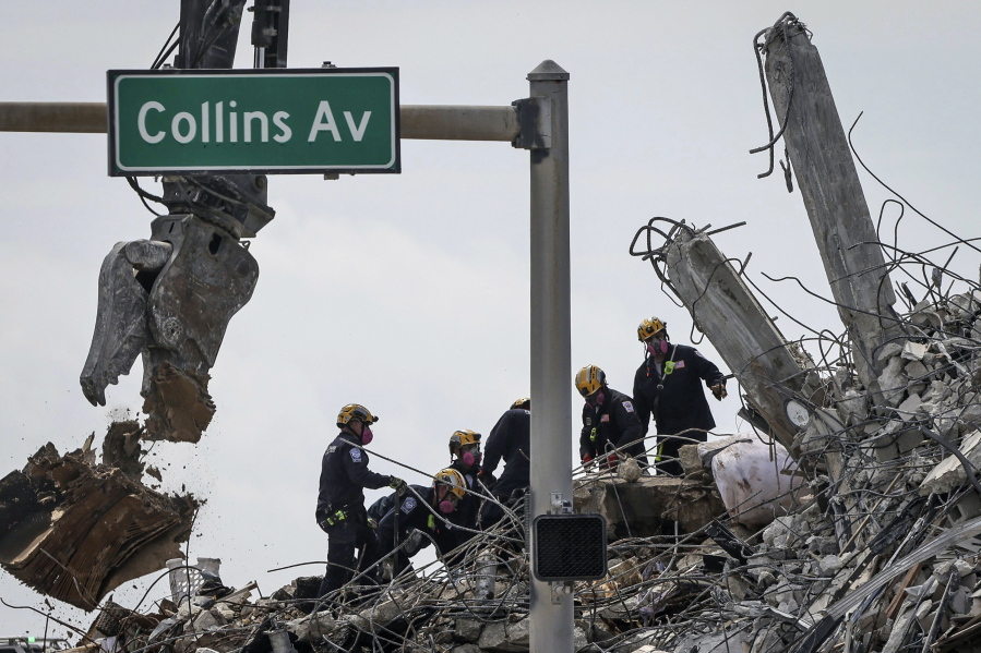 Search and rescue operations resumed as members of the Pennsylvania Search and Rescue team combed through the debris of the Champlain Tower South complex, Monday, July 5, 2021, in Surfside, Fla.