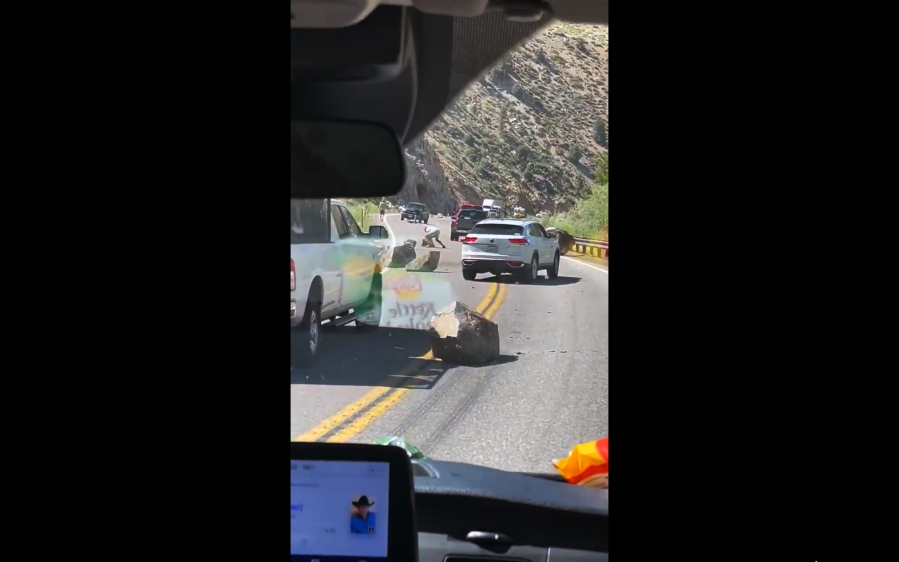 This image from video provided by Brett Durrant shows boulders blocking U.S. Route 395 near the California state line with Nevada, after an earthquake Thursday, July 8, 2021. An earthquake with a preliminary magnitude of 5.9 rattled the California-Nevada border Thursday afternoon, with people reporting feeling the shaking hundreds of miles away, according to the U.S. Geological Survey.