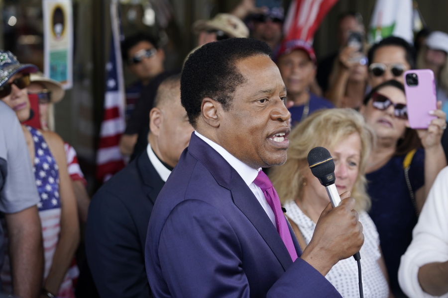 FILE - In this July 13, 2021, file photo, conservative radio talk show host Larry Elder speaks to supporters during a campaign stop in Norwalk, Calif. Elder was not on the list of candidates released Saturday in the recall election that could end the term of California Gov. Gavin Newsom.