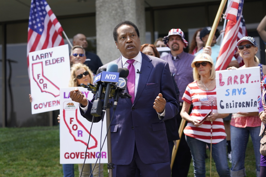 FILE -- In this July 13, 2021 file photo radio talk show host Larry Elder speaks to supporters during a campaign stop in Norwalk, Calif. Elder has announced his candidacy for governor in the Sept. 14 recall election but the California Secretary of State's office has rejected his candidacy saying Elder, a Republican, filed incomplete tax returns that are required to run. Elder is challenging the decision.