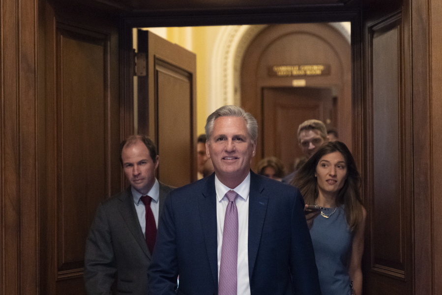 House Minority Leader Kevin McCarthy of Calif., center, leaves the floor after the House voted to create a select committee to investigate the Jan. 6 insurrection, at the Capitol in Washington, Wednesday, June 30, 2021.