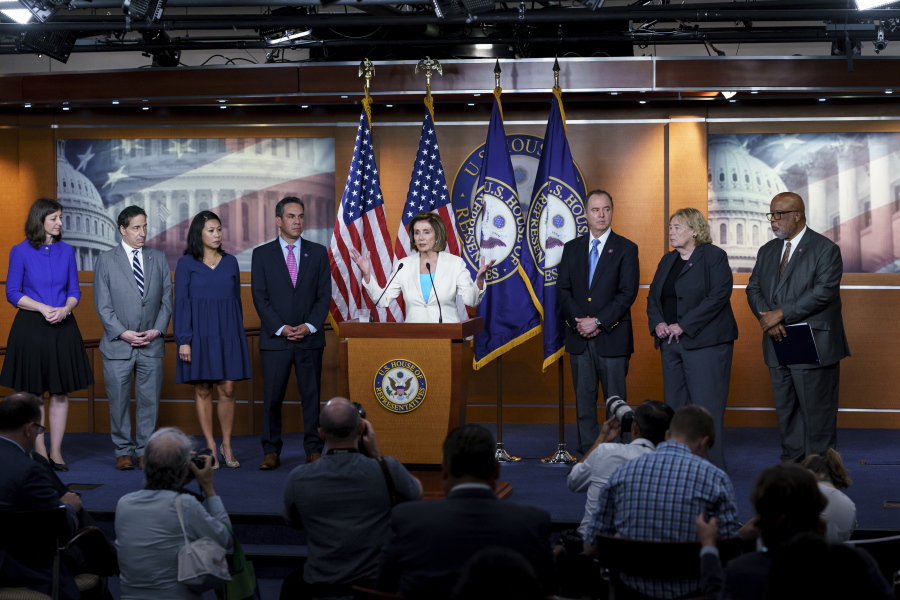 Speaker of the House Nancy Pelosi, D-Calif., announces Democratic appointments to a new select committee to investigate the violent Jan. 6 insurrection at the Capitol, on Capitol Hill in Washington, Thursday, July 1, 2021. From left are Rep. Elaine Luria, D-Va., Rep. Jamie Raskin, D-Md., Rep. Stephanie Murphy, D-Fla., Rep. Pete Aguilar, D-Calif., Rep. Adam Schiff, D-Calif., Rep. Zoe Lofgren, D-Calif., and Rep. Bennie Thompson D-Miss., who will lead the panel. Rep. Liz Cheney, R-Wyo., who was ousted from the GOP leadership for criticizing Trump, accepted Pelosi's invitation to join the committee. (AP Photo/J.