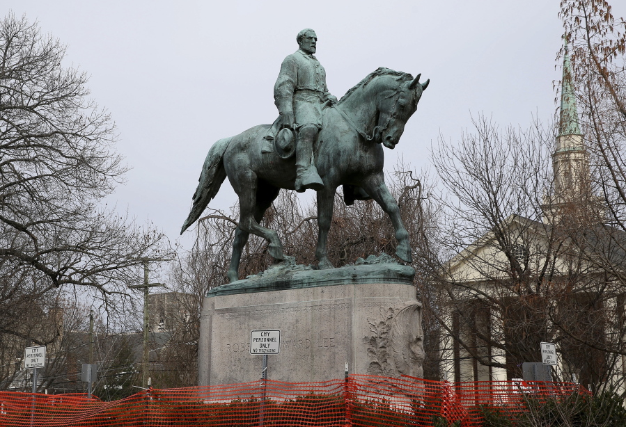 FILE - The statue of Robert E. Lee is seen uncovered in Emancipation Park in Charlottesville, Va., on Wednesday, Feb. 28, 2018.  Charlottesville said in a news release Friday, July 9, 2021,   that the equestrian statue of Confederate Gen. Robert E. Lee as well as a nearby one of Confederate Gen. Thomas "Stonewall" Jackson will be taken down Saturday.