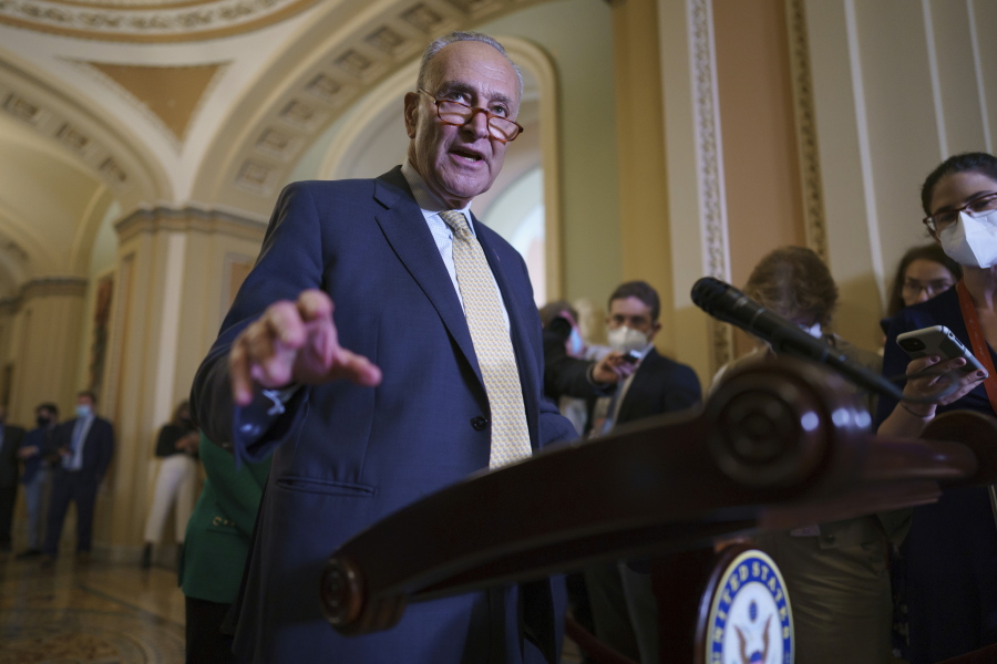 Senate Majority Leader Chuck Schumer, D-N.Y., speaks to reporters as intense negotiations continue to salvage a bipartisan infrastructure deal, at the Capitol in Washington, Tuesday, July 27, 2021. (AP Photo/J.