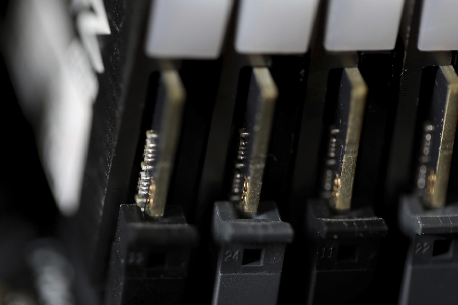 FILE - This Feb 23, 2019, file photo shows the inside of a computer in Jersey City, N.J. The Biden administration will offer rewards up to $10 million for information leading to the identification of foreign state-sanctioned malicious cyber activity against critical U.S. infrastructure, including ransomware attacks. The administration is launching the website stopransomware.gov to offer the public resources for countering the threat.