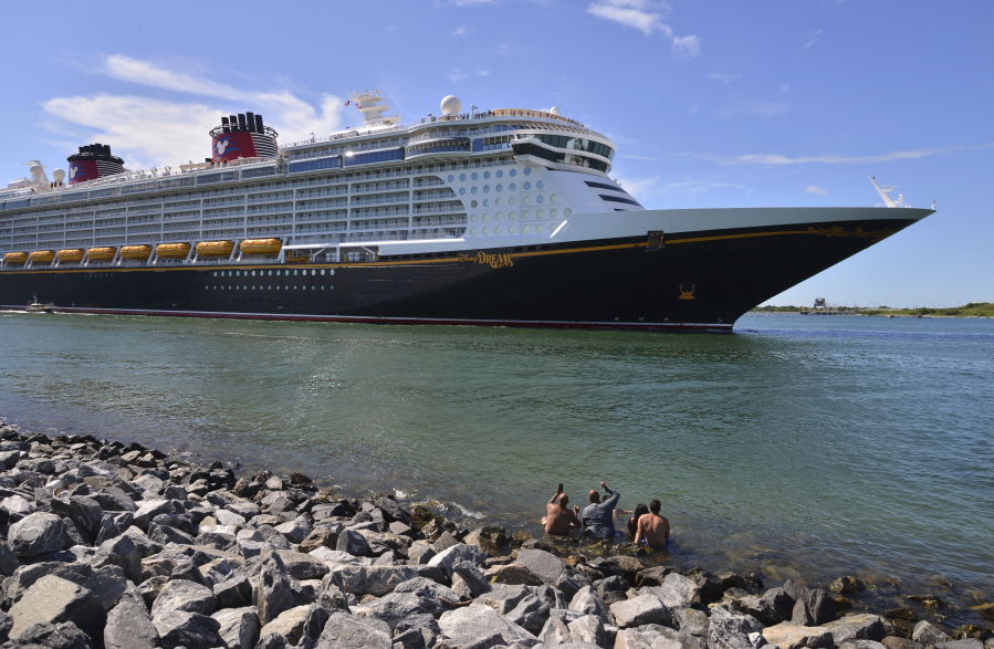 The Disney Dream sails out of Port Canaveral, Fla. on a two night test sailing, also known as a simulation cruise, Saturday, July 17, 2021. The cruise included about 300 Disney cruise employees and their guests. This is the first cruise activity out of Port Canaveral since March of 2020 when cruising was shut down due to COVID-19.