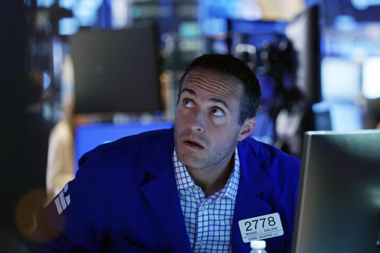 Specialist Michael Gagliano works at his post on the trading floor of the New York Stock Exchange, Tuesday, July 20, 2021. Stocks are opening higher on Wall Street Tuesday as investors shake off a rout a day earlier brought on by concerns about the spread of a more contagious variant of COVID-19.