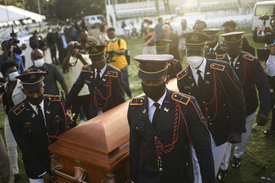 Police carry the coffin of slain Haitian President Jovenel Moise at the start of the funeral at his family home in Cap-Haitien, Haiti, early Friday, July 23, 2021. Moise was assassinated at his home in Port-au-Prince on July 7.