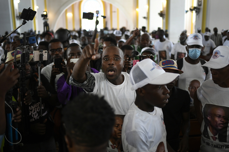 A man yells for justice during a memorial service for assassinated Haitian President Jovenel Mo?se in the Cathedral of Cap-Haitien, Haiti, Thursday, July 22, 2021. Mo?se was killed in his home on July 7.