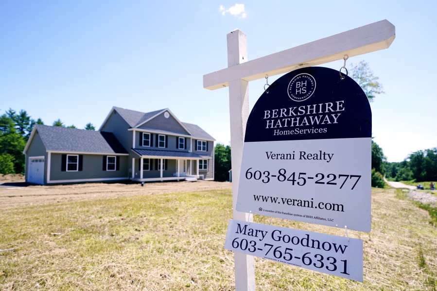 A real estate sign is posted in front of a newly constructed single family home, Thursday, June 24, 2021 in Auburn, N.H.  U.S. home prices soared in April at the fastest pace since 2005 as Americans bid up prices on a limited supply of available properties.