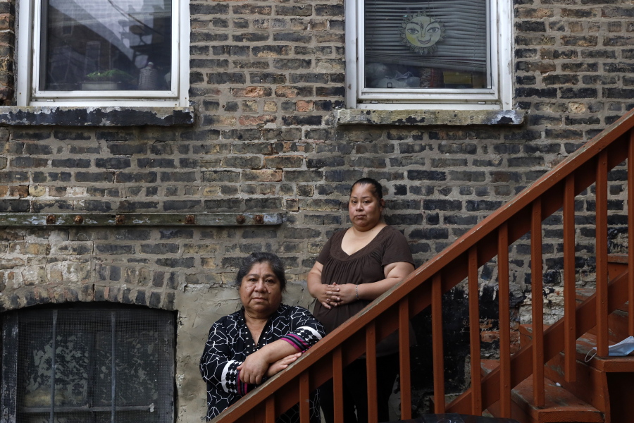 Maria Elena Estamilla, 62, left, and her daughter, Esmeralda Triquiz, pose for a photo last month in Chicago's Pilsen neighborhood. Estamilla's last full medical exam was in 2015; she sees no options for care as an immigrant without legal permission to live in the U.S.
