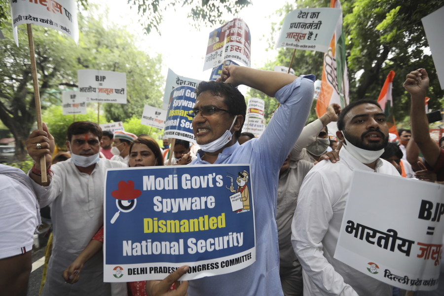 Congress party workers shout slogans during a protest accusing Prime Minister Narendra Modi's government of using military-grade spyware to monitor political opponents, journalists and activists in New Delhi, India, Tuesday, July 20, 2021. The protests came after an investigation by a global media consortium was published on Sunday. Based on leaked targeting data, the findings provided evidence that the spyware from Israel-based NSO Group, the world's most infamous hacker-for-hire company, was used to allegedly infiltrate devices belonging to a range of targets, including journalists, activists and political opponents in 50 countries.